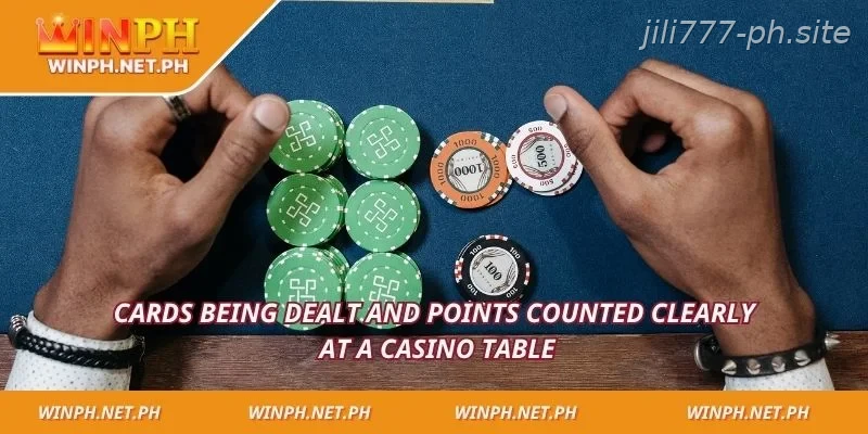 Cards being dealt and points counted clearly at a casino table